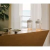 Discover the crystal portable lamp by Saint-Louis, in white wood and vibrant silver