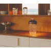 Discover the dark wood and crystal portable lamp by Saint-Louis